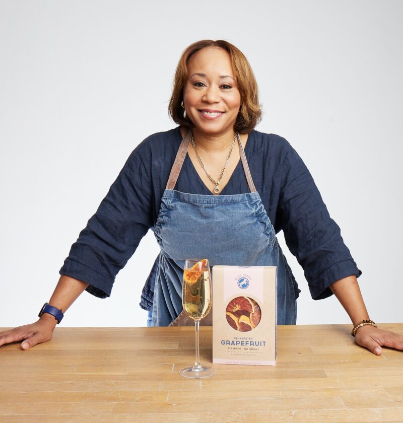 BlueHenry Founder/CEO, Adrienne Walker, pictured with one of her products, Grapefruit Dehydrated Cocktail Garnish