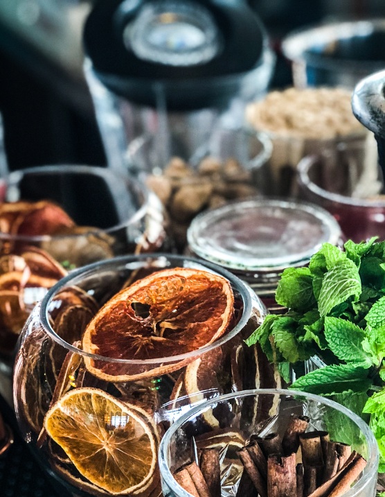 Variety of dehydrated fruit garnish stocked at a bar
